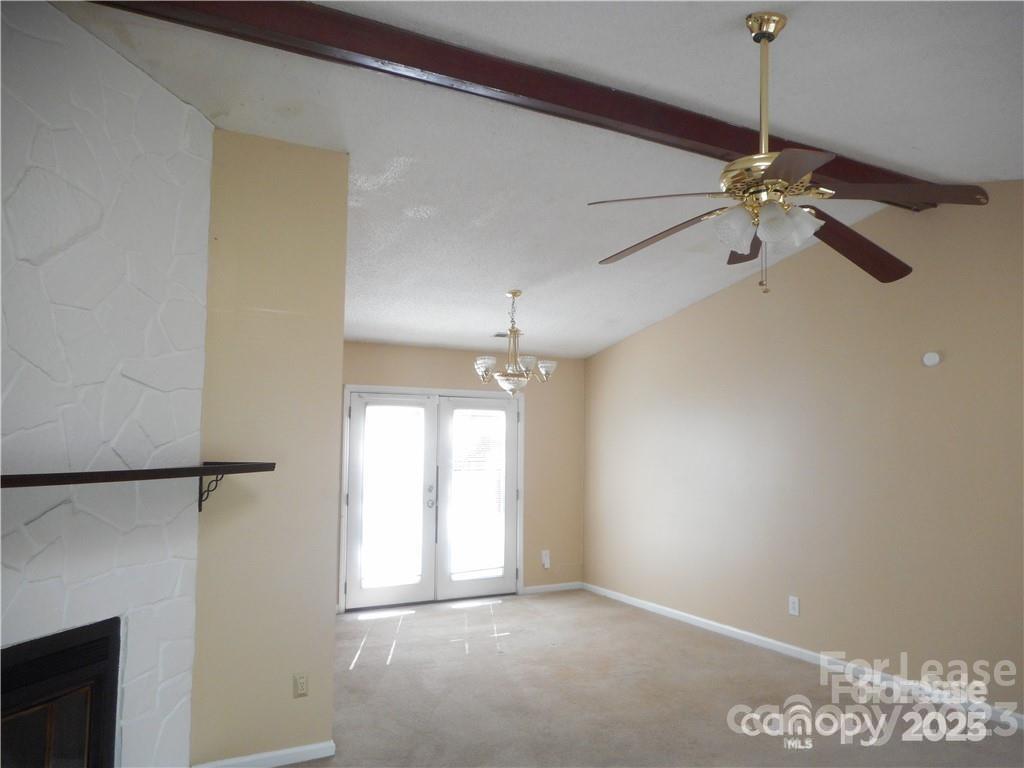 8319 Golf Ridge Drive Charlotte, NC 28277 - Photo 9 of 20 a view of an empty room with a ceiling fan and window