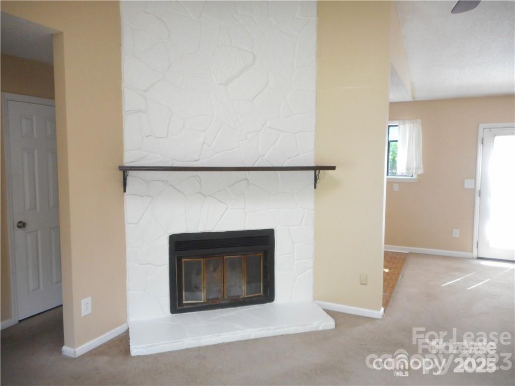 8319 Golf Ridge Drive Charlotte, NC 28277 - Photo 10 of 20 a living room with a fireplace