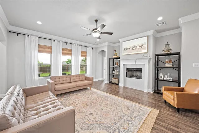 a kitchen with stainless steel appliances granite countertop a kitchen island a stove a table and chairs in it