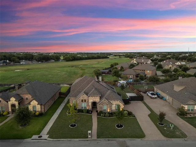 an aerial view of a house with a garden