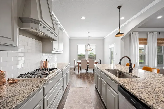 a bathroom with a double vanity sink mirror and toilet