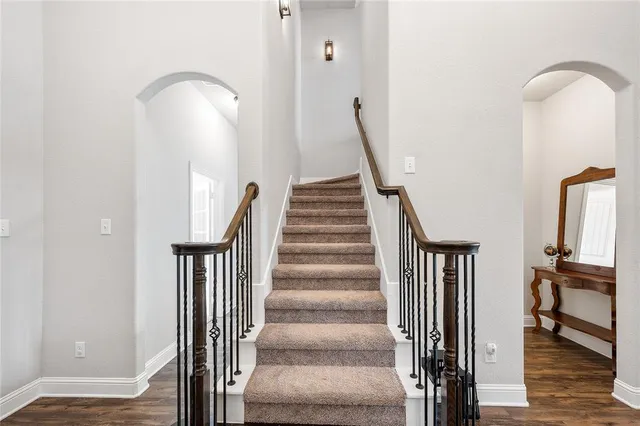 a bathroom with a sink a toilet and shower curtain