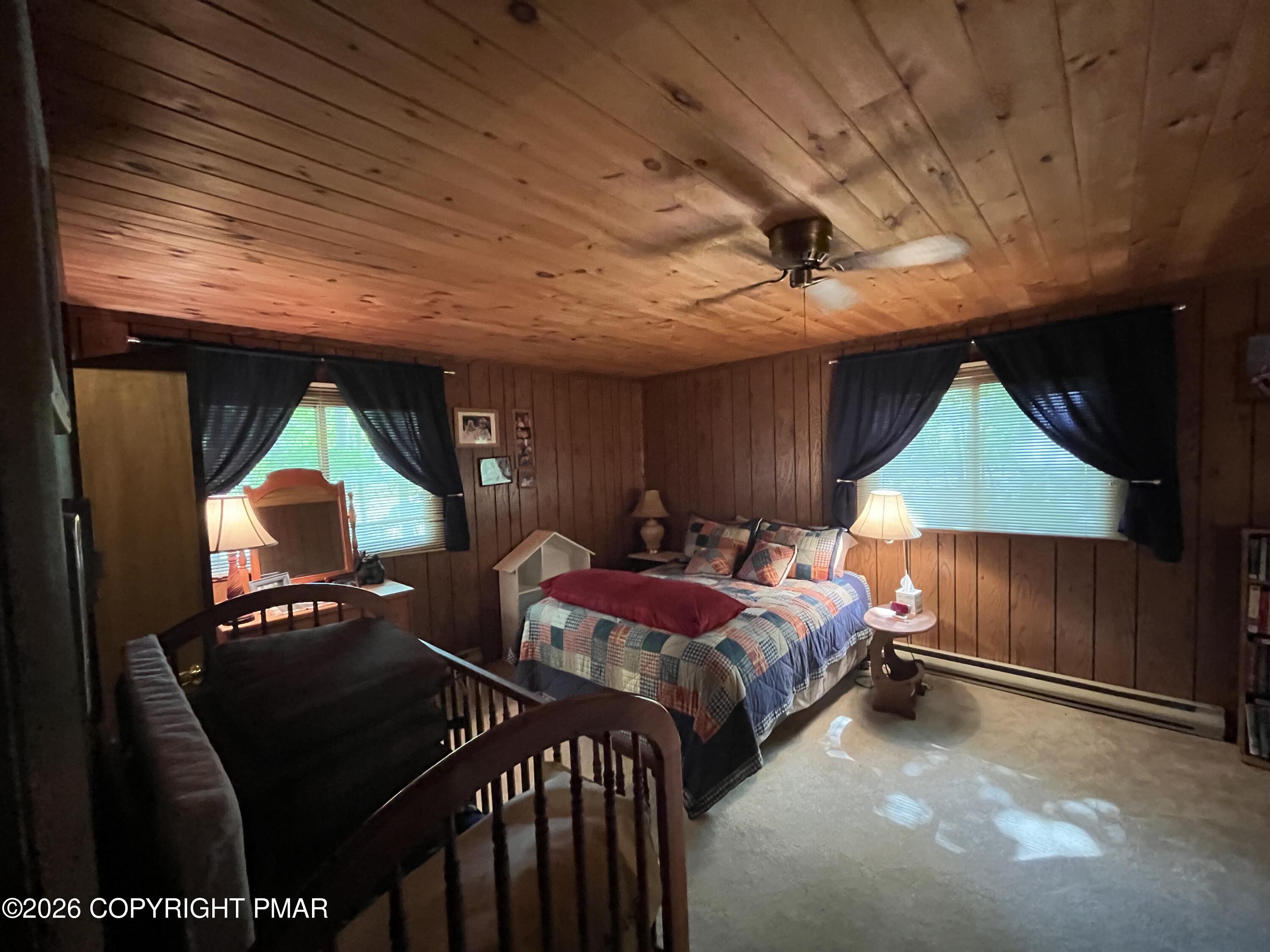 5970 Decker Road Bushkill, PA 18324 - Photo 25 of 26 a bedroom with two beds and a lamp