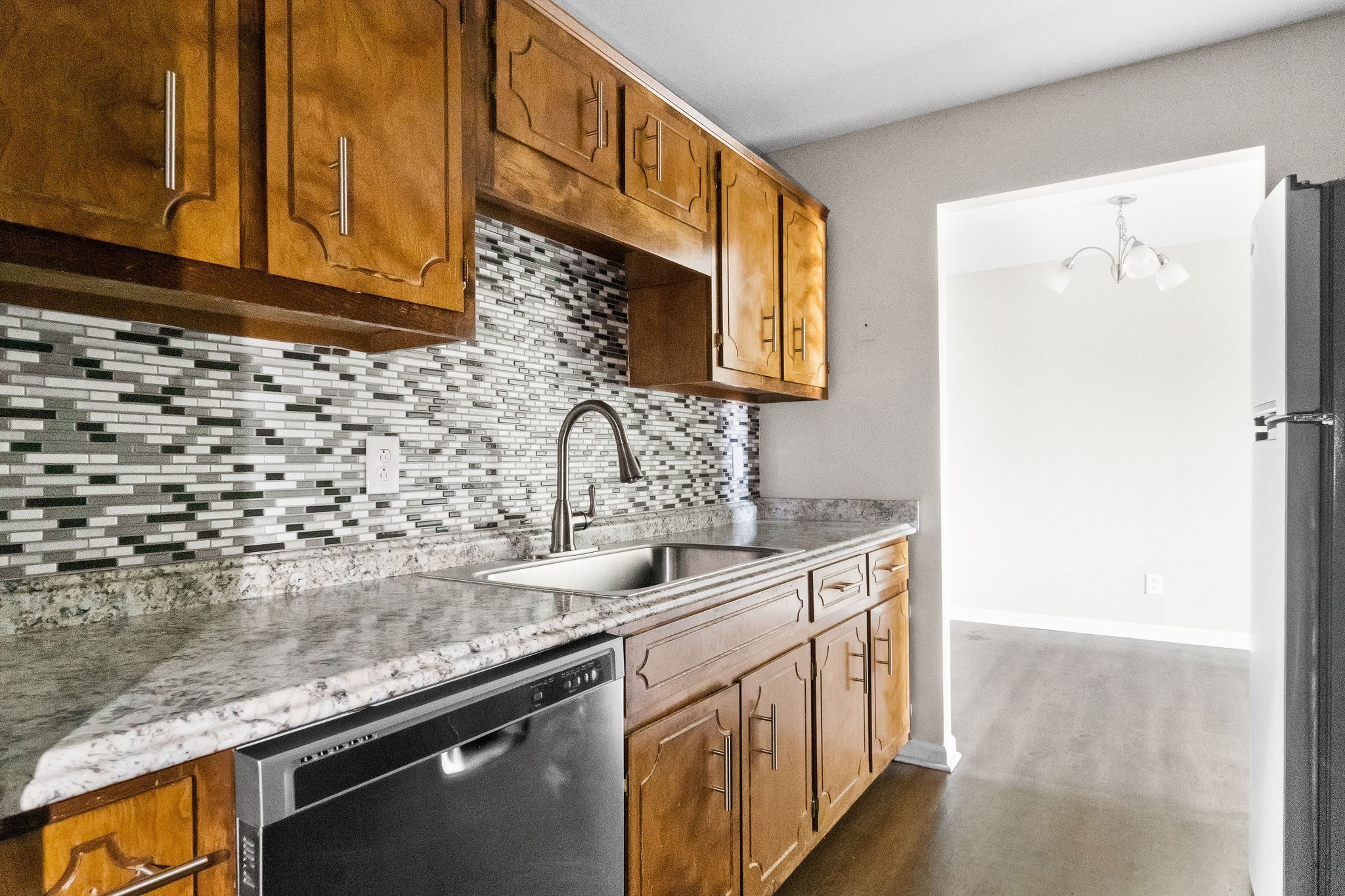 3855 Northeast Drive, Unit H Clarksville, TN 37040 - Photo 12 of 23 a kitchen with a sink a stove and a refrigerator
