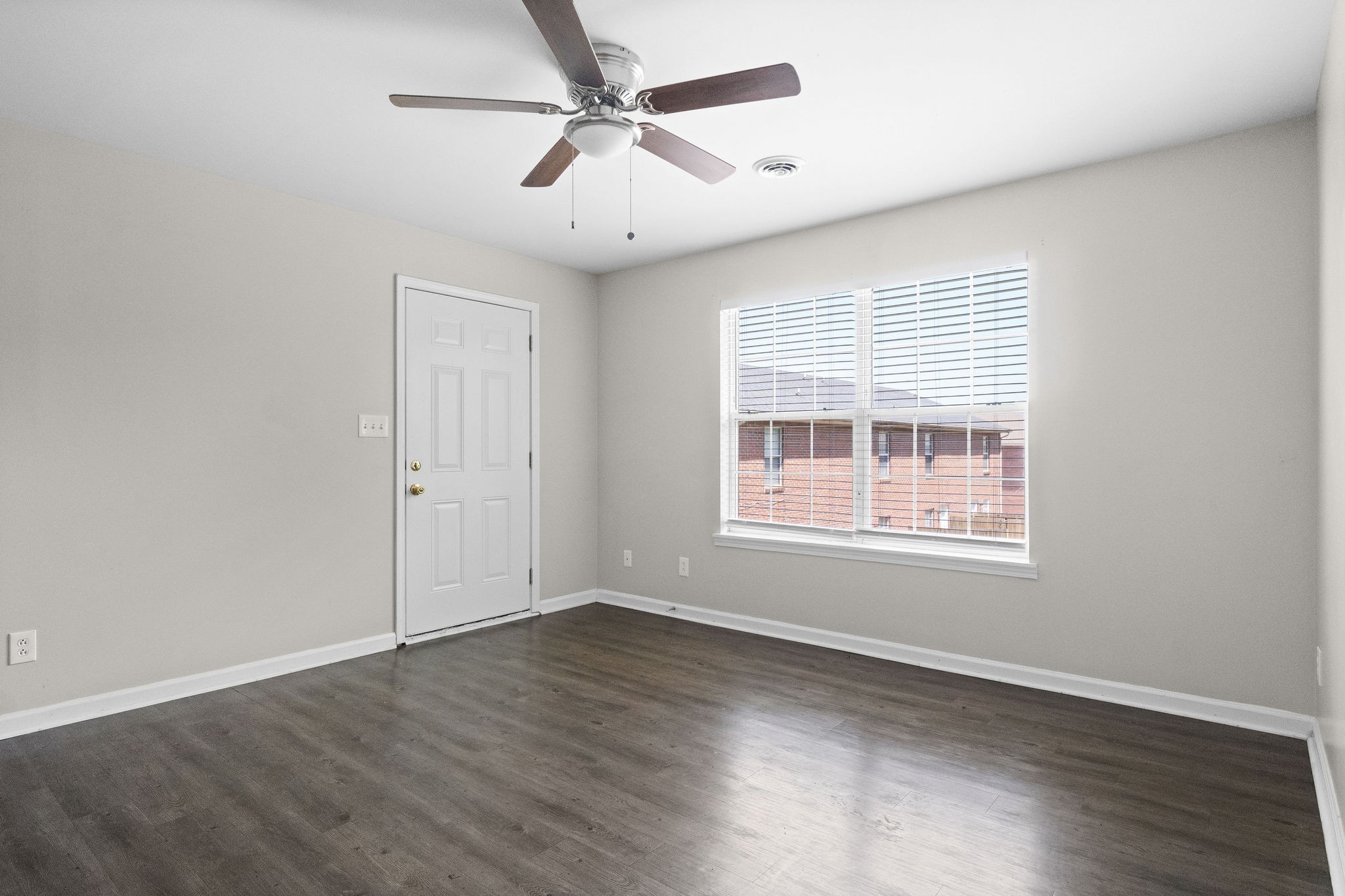 3855 Northeast Drive, Unit H Clarksville, TN 37040 - Photo 6 of 23 a view of an empty room with wooden floor and a window