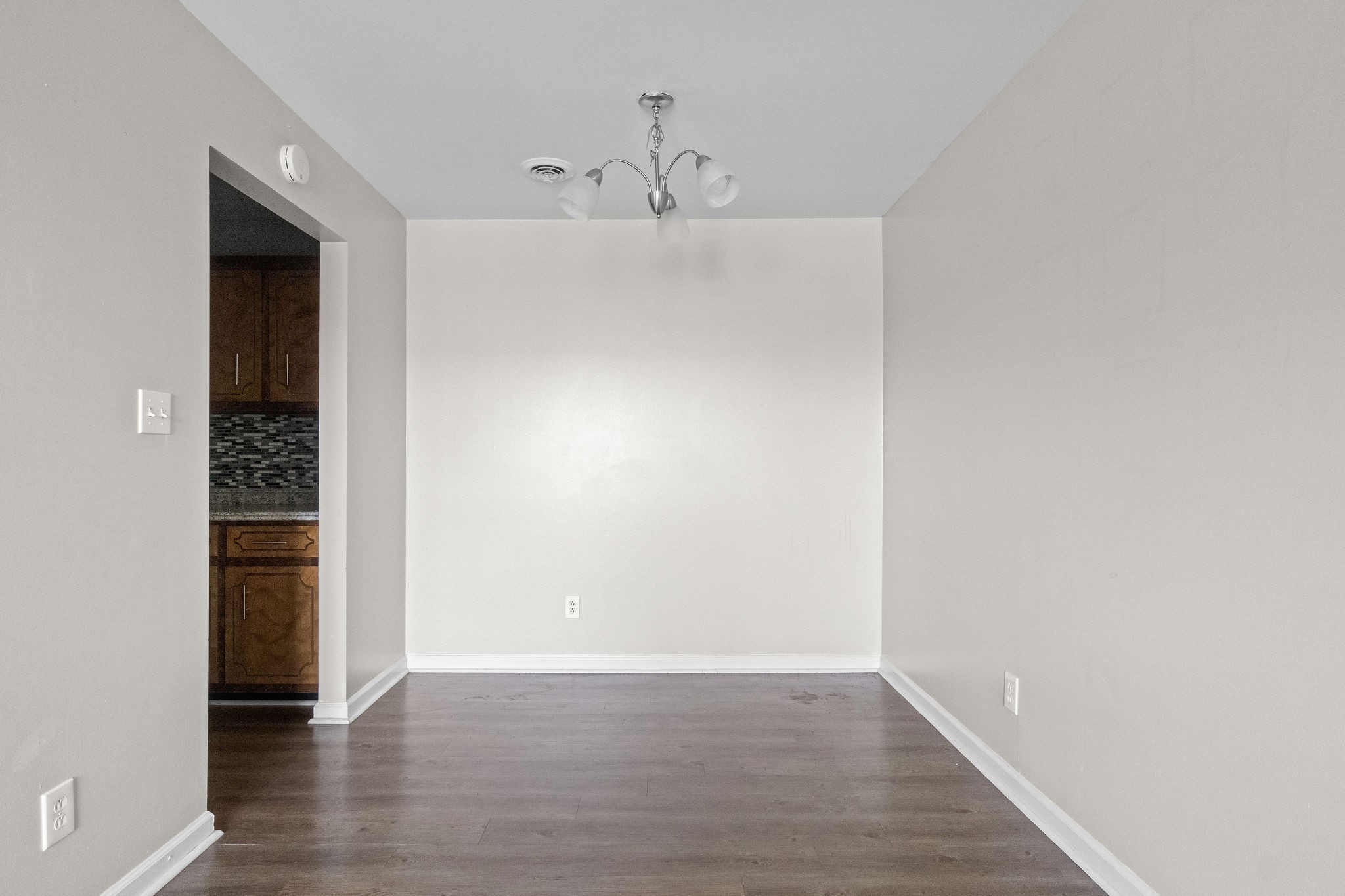 3855 Northeast Drive, Unit H Clarksville, TN 37040 - Photo 8 of 23 a view of an empty room with wooden floor and a window