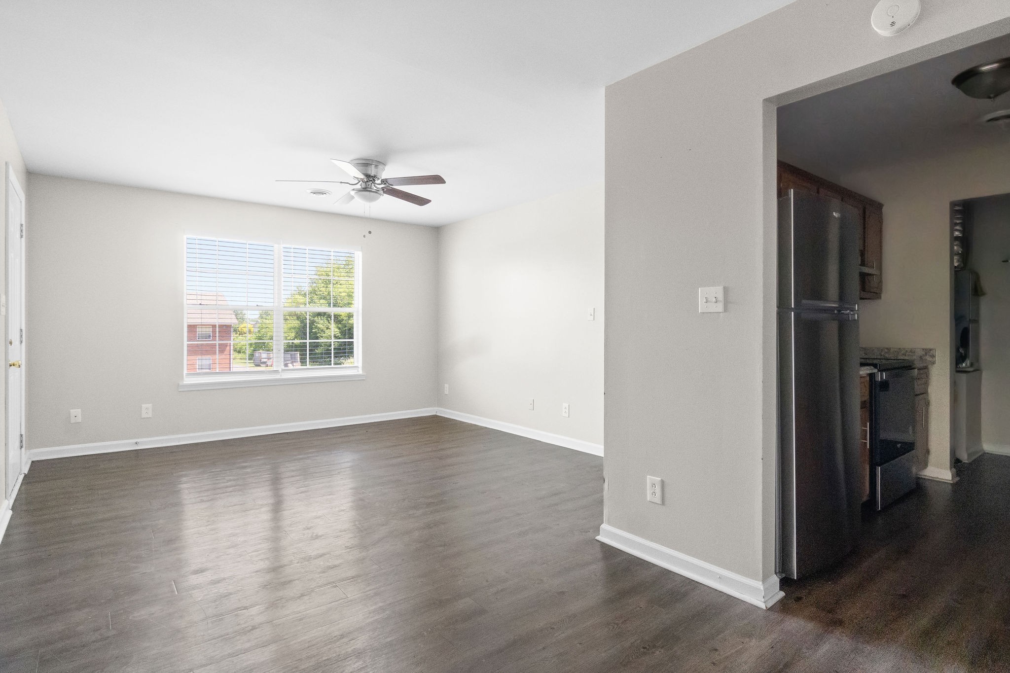 3855 Northeast Drive, Unit H Clarksville, TN 37040 - Photo 9 of 23 wooden floor in an empty room with a window