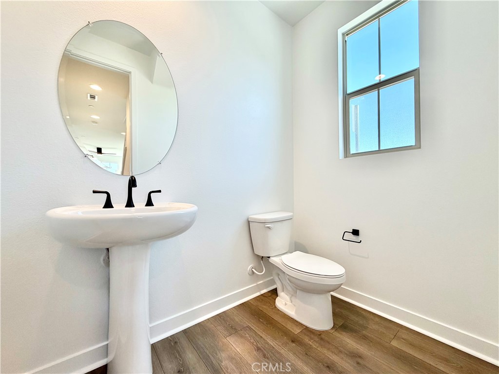 29561 Monarch Road Menifee, CA 92586 - Photo 13 of 35 a bathroom with a sink and a mirror