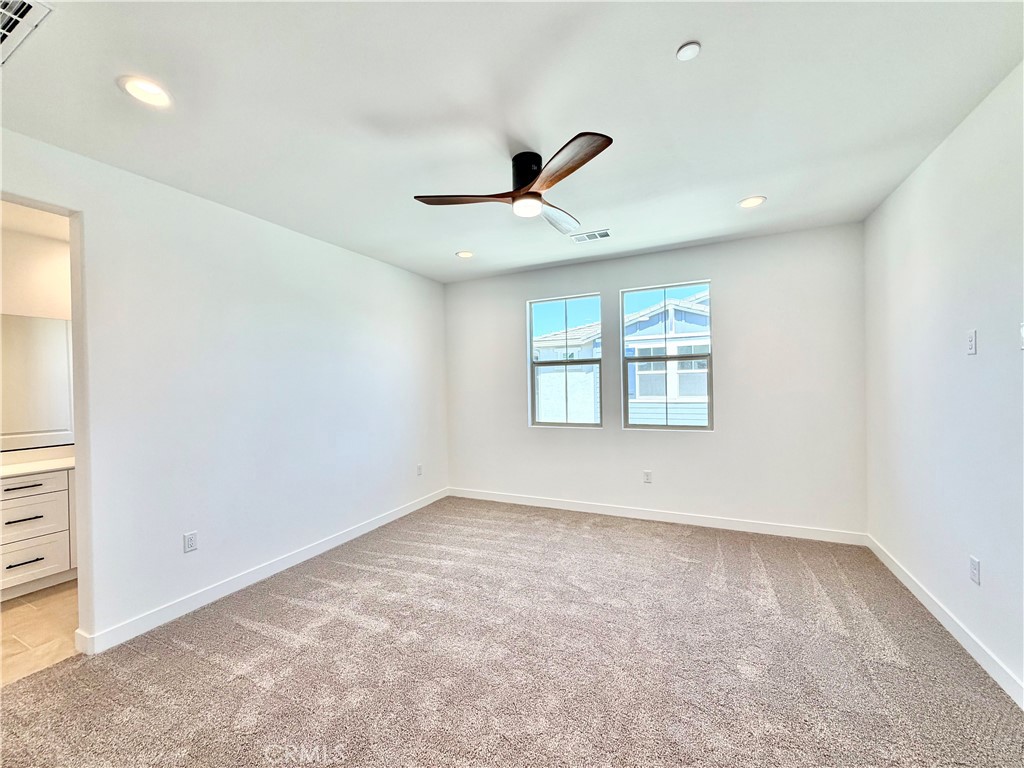 29561 Monarch Road Menifee, CA 92586 - Photo 16 of 35 wooden floor in an empty room with a window