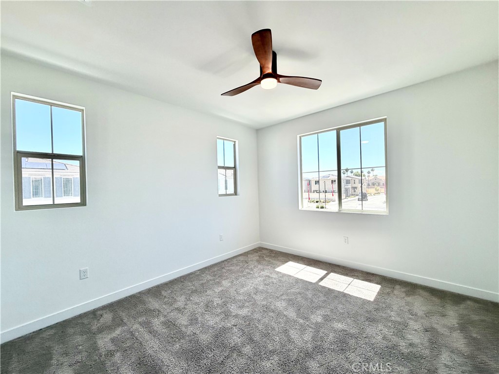 29561 Monarch Road Menifee, CA 92586 - Photo 29 of 35 a view of empty room with ceiling fan