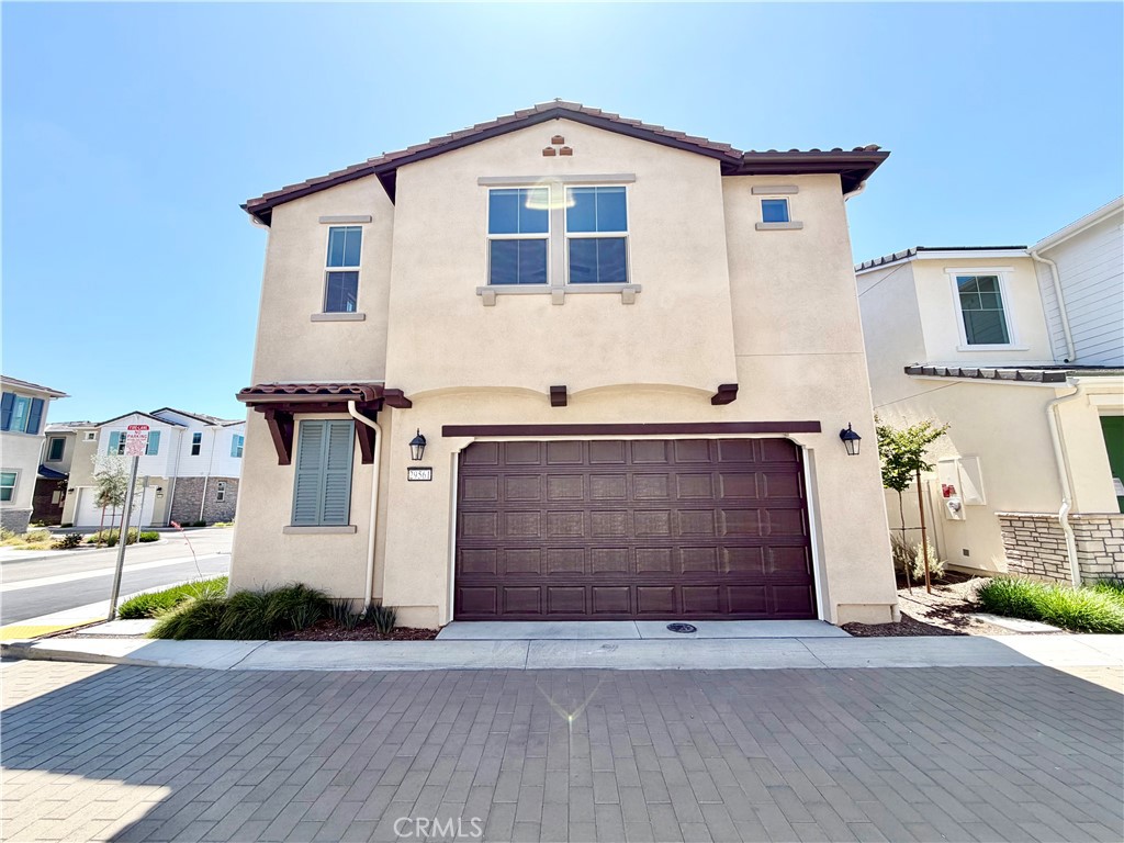 29561 Monarch Road Menifee, CA 92586 - Photo 4 of 35 a front view of a house with a garage