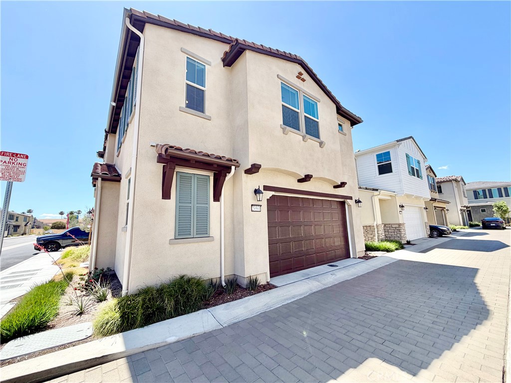 29561 Monarch Road Menifee, CA 92586 - Photo 6 of 35 a front view of a house with a yard