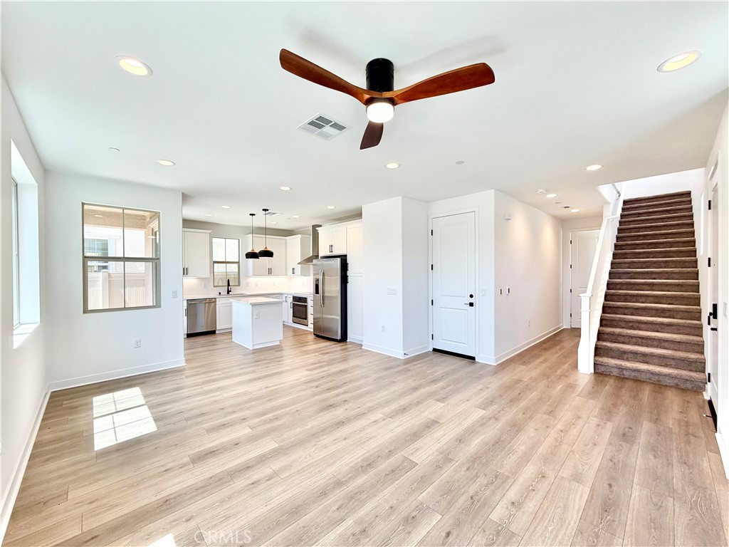29561 Monarch Road Menifee, CA 92586 - Photo 9 of 35 a view of a livingroom with kitchen appliances and furniture