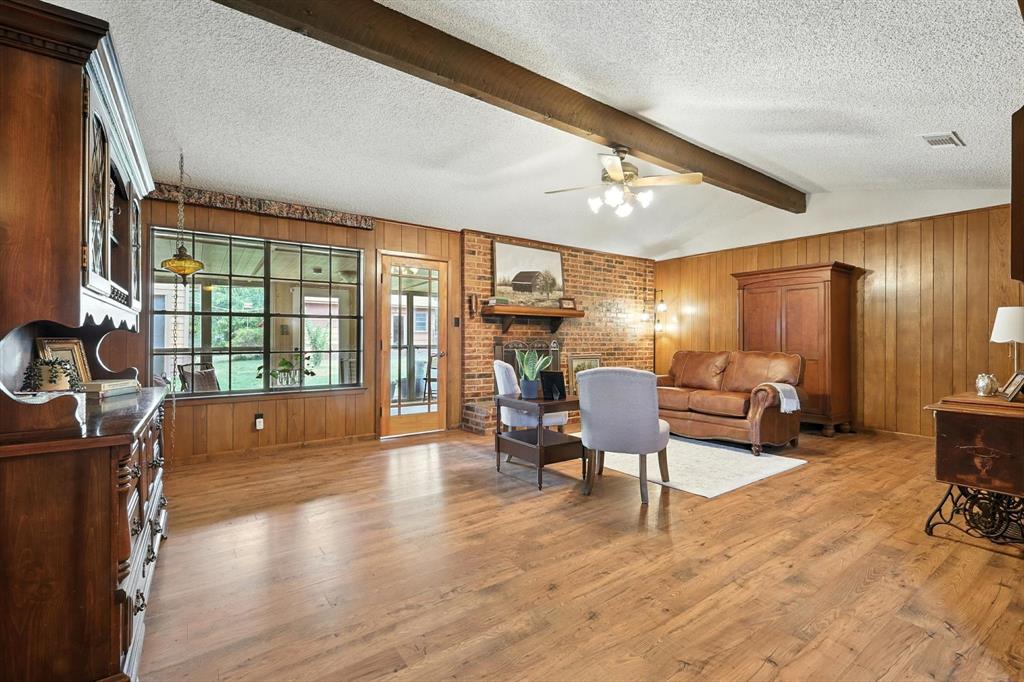 905 Clearview Drive Krum, TX 76249 - Photo 11 of 38 a living room filled furniture and a wooden floor
