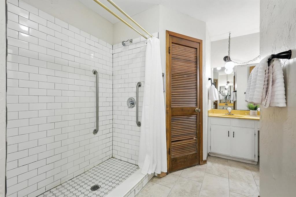 905 Clearview Drive Krum, TX 76249 - Photo 23 of 38 a bathroom with a shower