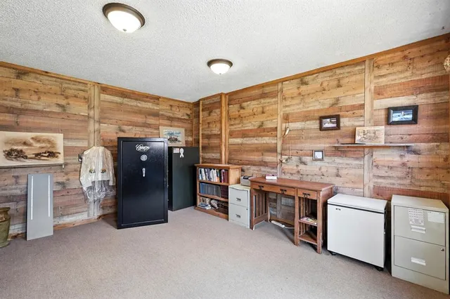 a kitchen with stainless steel appliances granite countertop a stove and a refrigerator