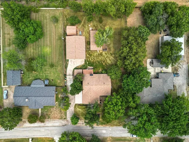 an aerial view of a house with outdoor space and lake view