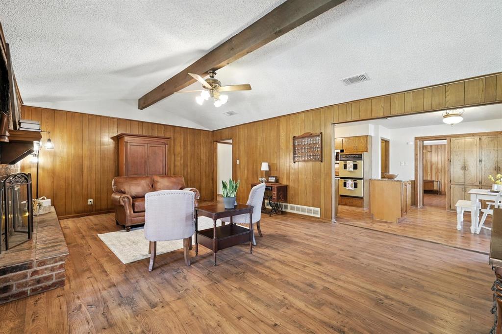 905 Clearview Drive Krum, TX 76249 - Photo 9 of 38 a living room with furniture a dining table a lamp and a large window