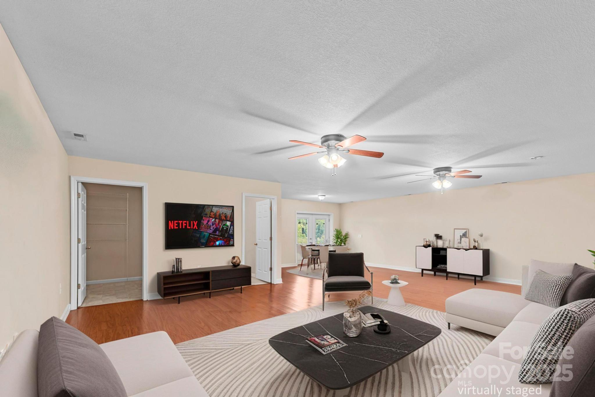 2133 Olde Farm Road Southeast Hudson, NC 28638 - Photo 17 of 42 a living room with furniture and a flat screen tv