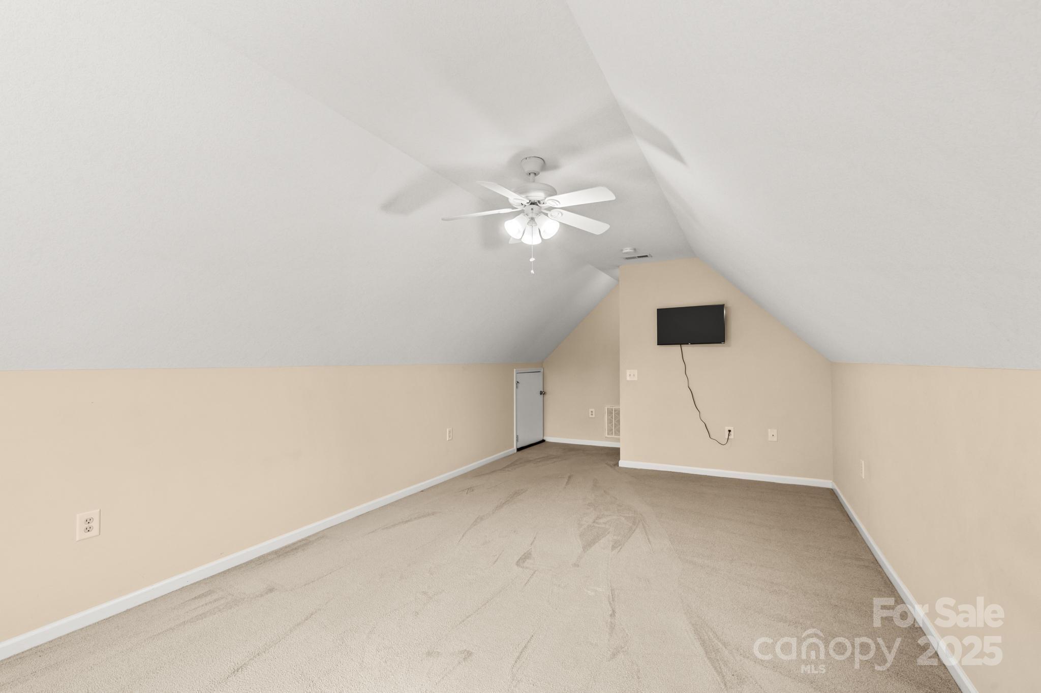 2133 Olde Farm Road Southeast Hudson, NC 28638 - Photo 18 of 42 an empty room with a ceiling fan and window