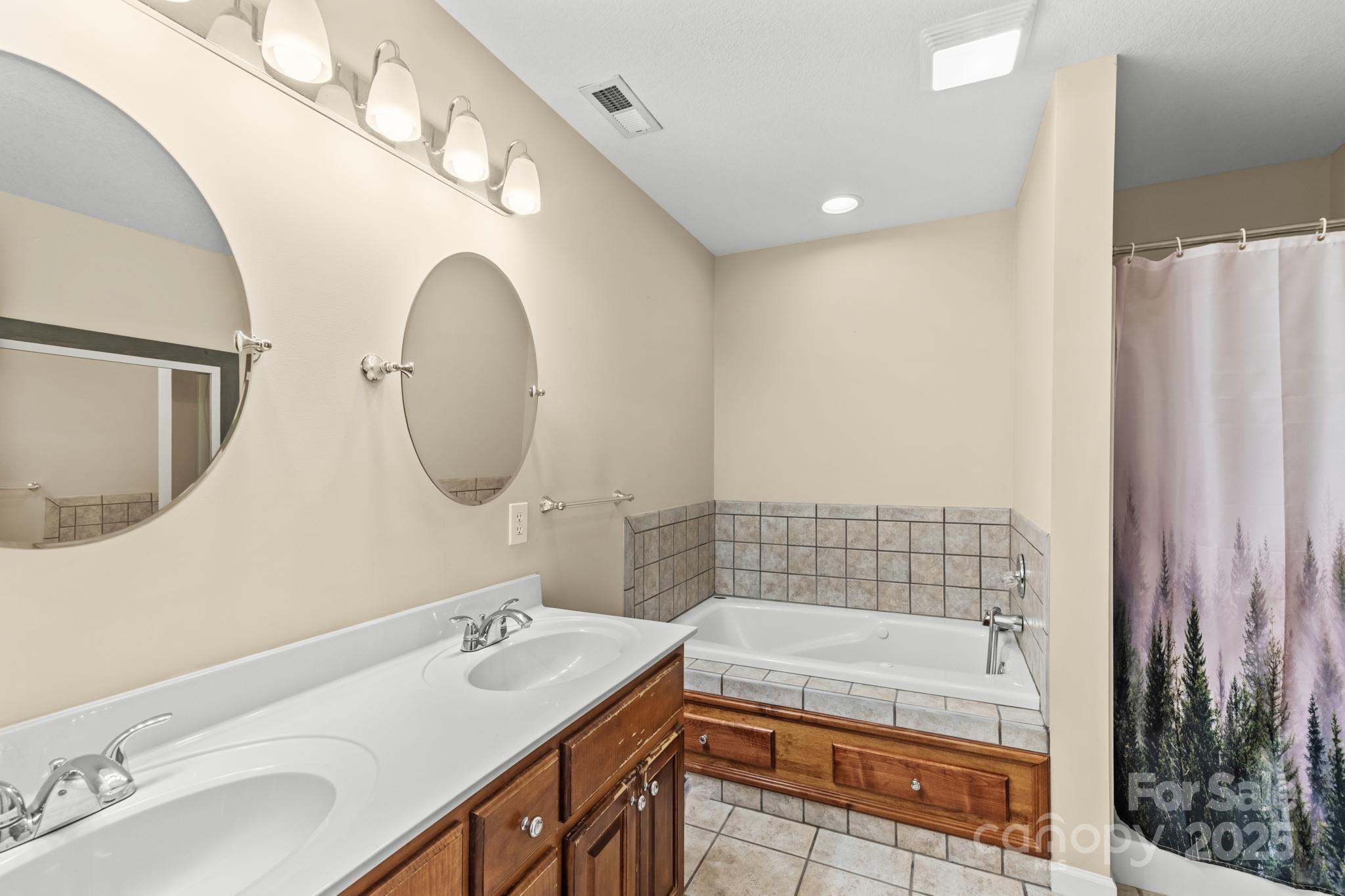 2133 Olde Farm Road Southeast Hudson, NC 28638 - Photo 27 of 42 a bathroom with a sink and a mirror