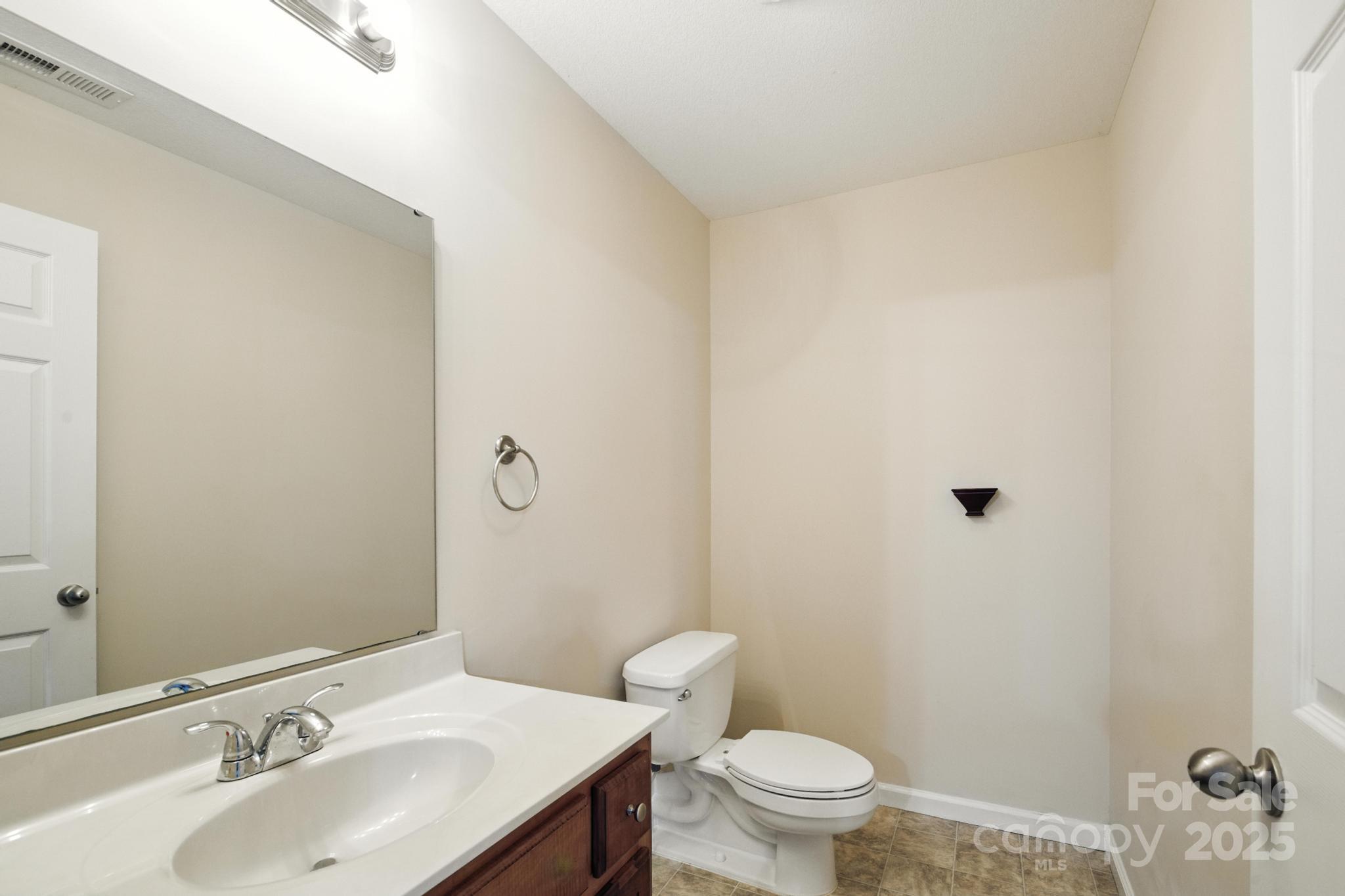 2133 Olde Farm Road Southeast Hudson, NC 28638 - Photo 30 of 42 a bathroom with a sink toilet and a mirror