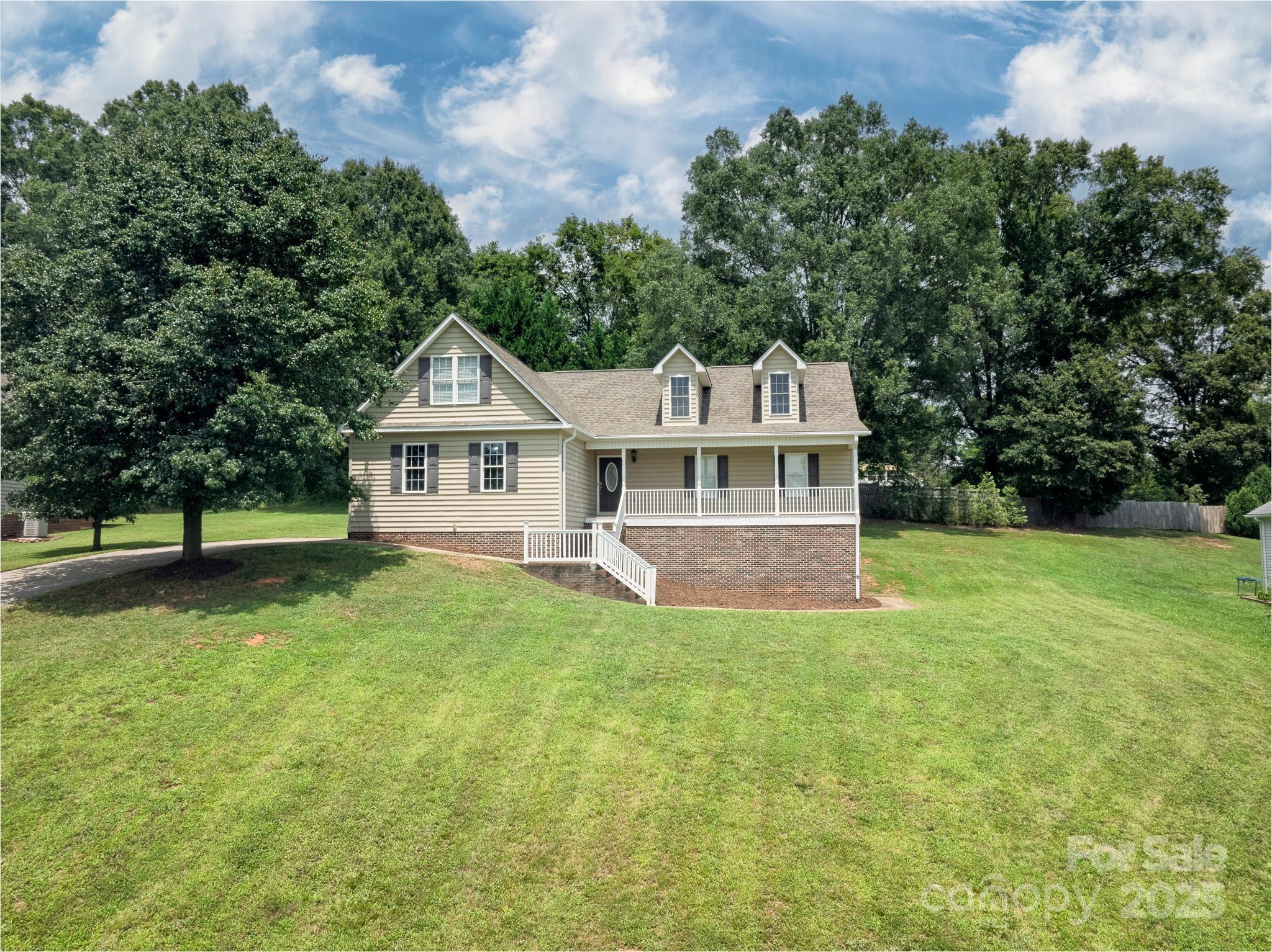 2133 Olde Farm Road Southeast Hudson, NC 28638 - Photo 3 of 42 a front view of a house with a garden