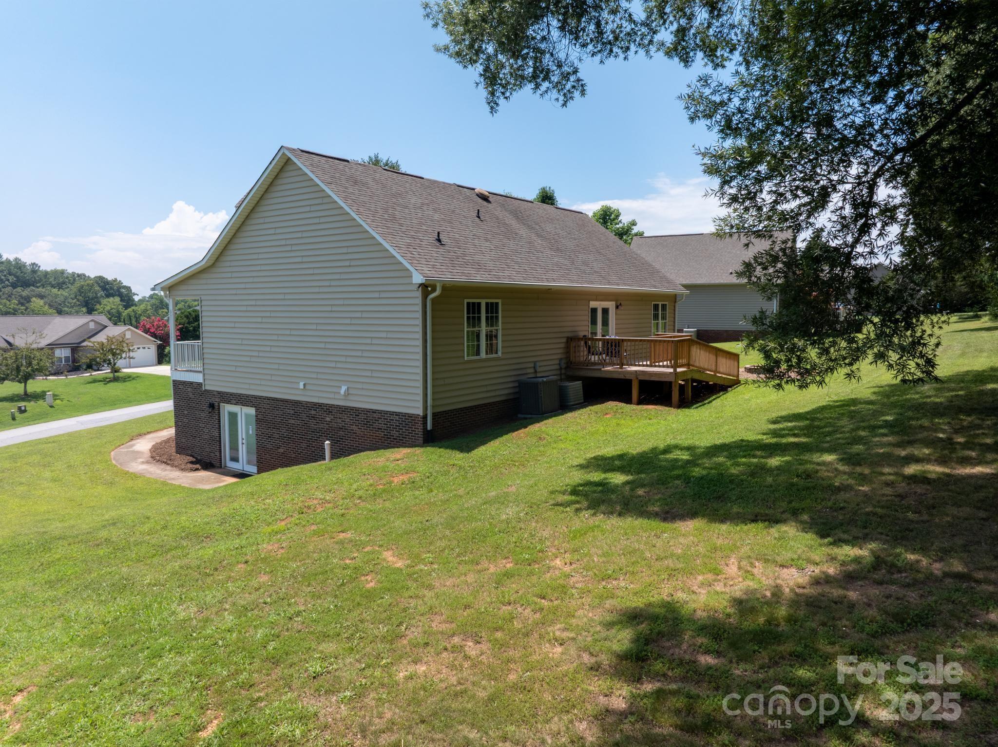 2133 Olde Farm Road Southeast Hudson, NC 28638 - Photo 39 of 42 a view of a house with a yard and a large tree