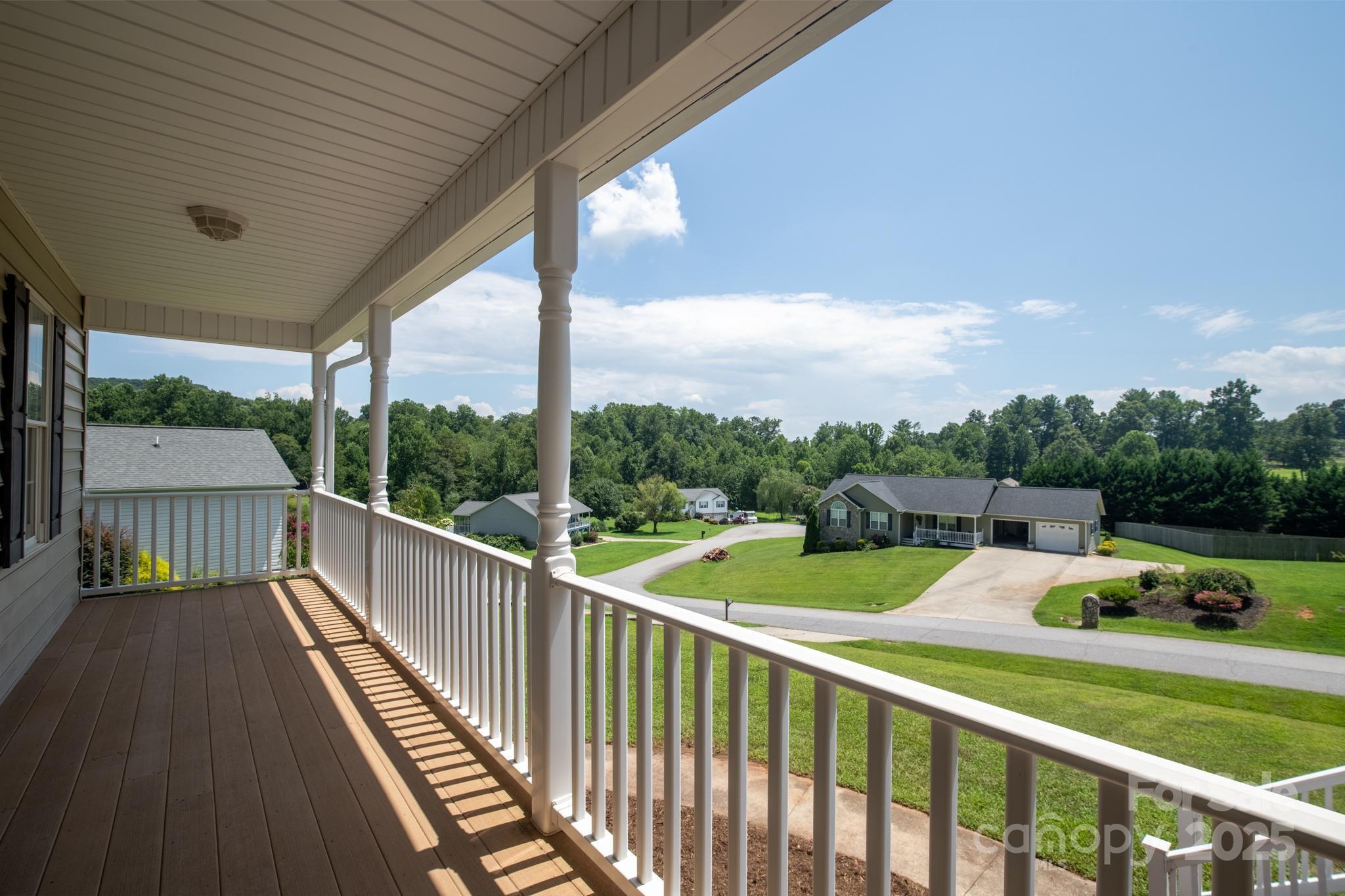 2133 Olde Farm Road Southeast Hudson, NC 28638 - Photo 4 of 42 a view of a balcony with wooden floor & fence