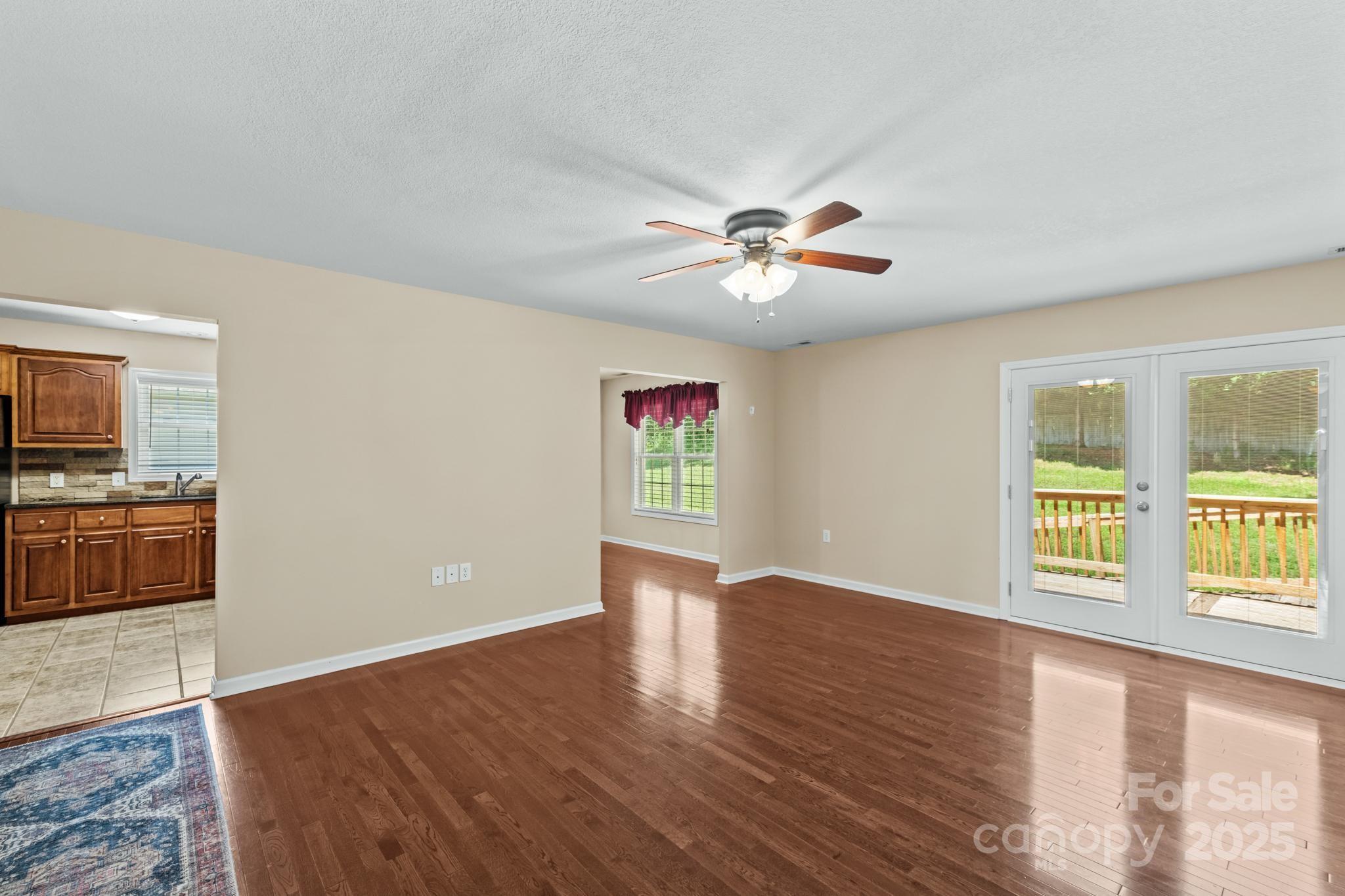 2133 Olde Farm Road Southeast Hudson, NC 28638 - Photo 6 of 42 wooden floor in an empty room with a window