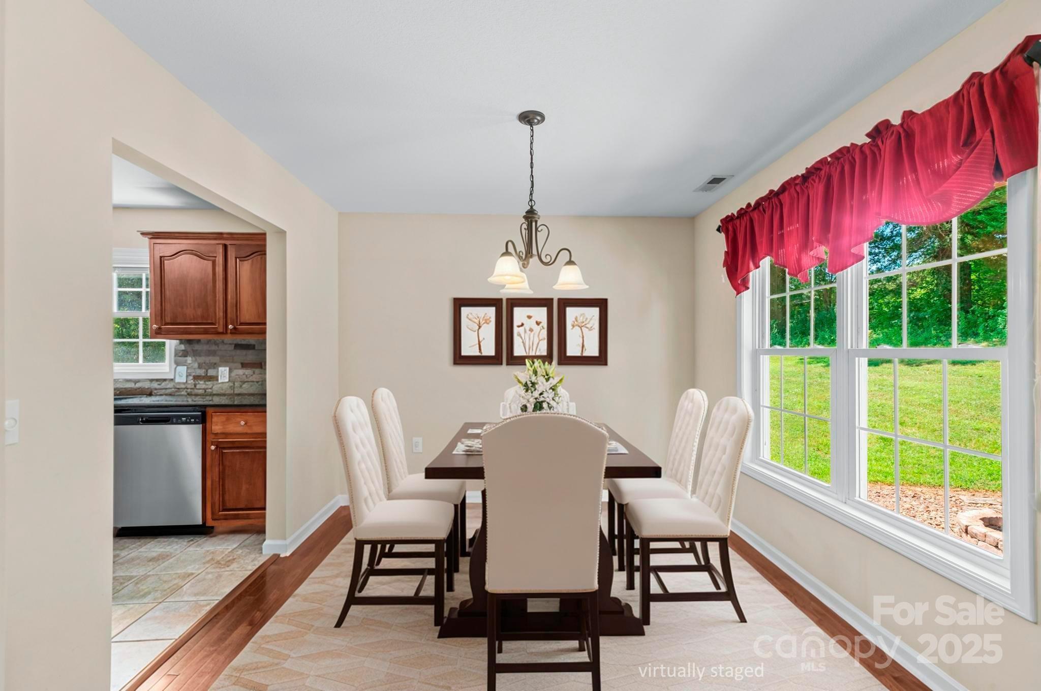 2133 Olde Farm Road Southeast Hudson, NC 28638 - Photo 10 of 42 a dining room with furniture a chandelier and window