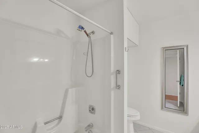 a bathroom with a sink double vanity granite tub and shower