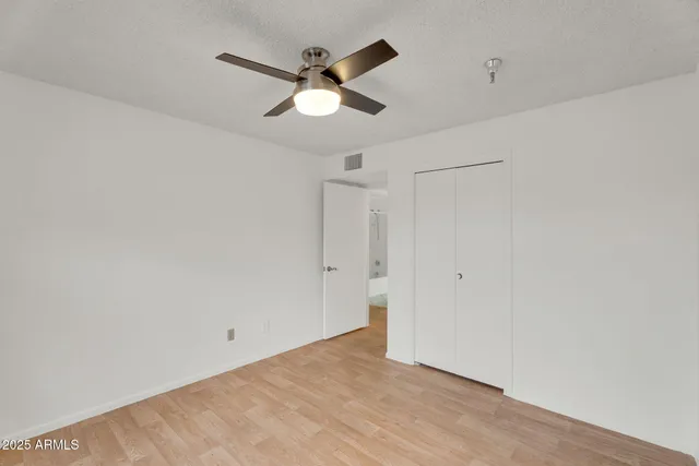 a bedroom with a bed and a dresser