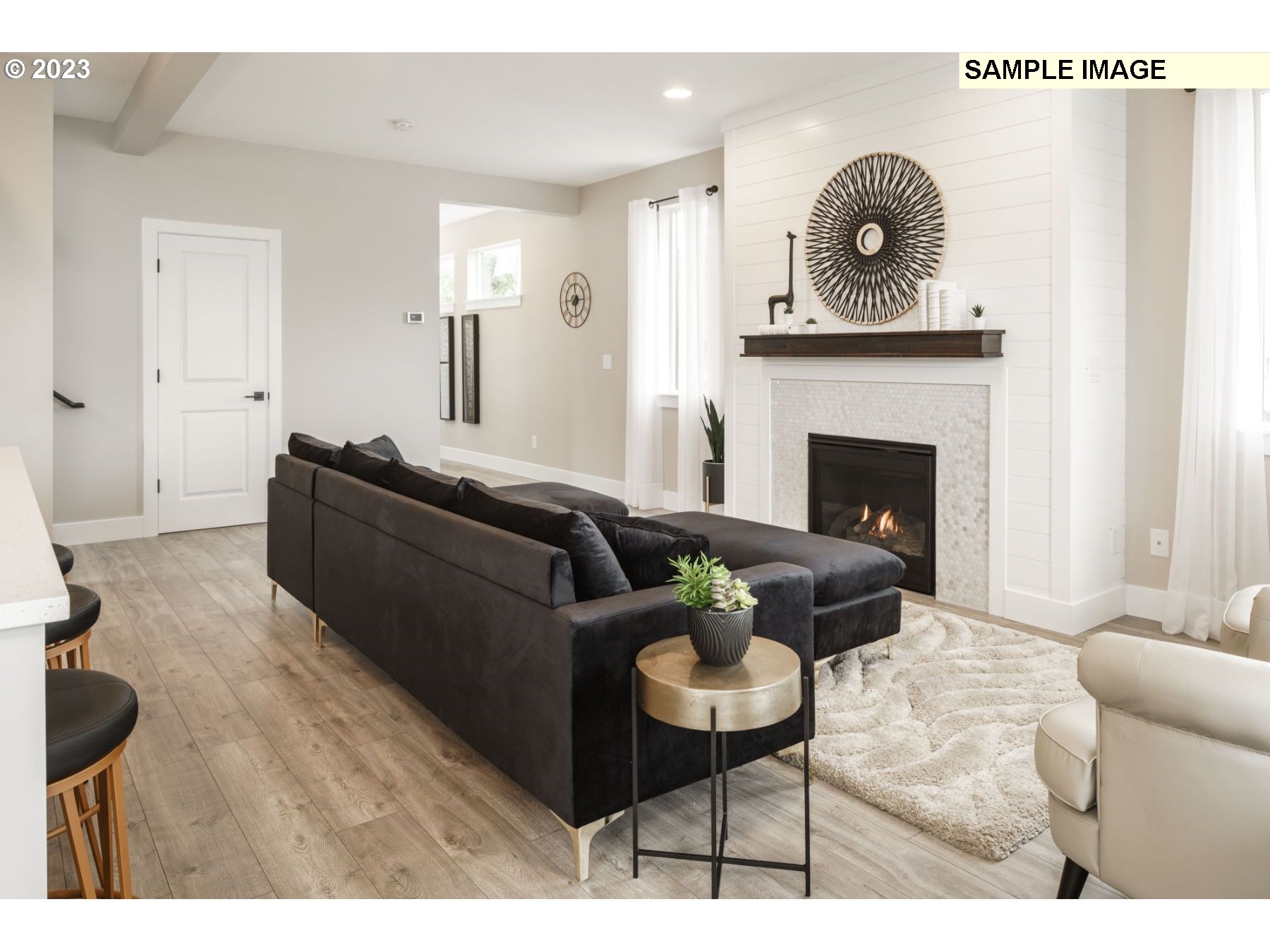 17801 Northwest 7th Avenue, Unit 76 Ridgefield, WA 98642 - Photo 8 of 20 a living room with furniture and a fireplace