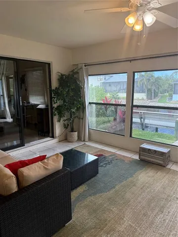 a view of a livingroom with furniture and window