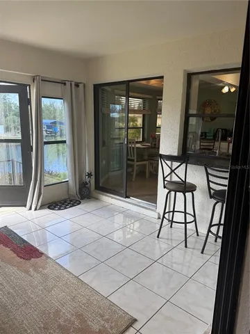 a white toilet and tub sitting next to a bathroom sink