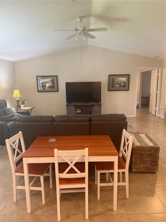 3601 Magnolia Way Punta Gorda, FL 33950 - Photo 16 of 26 a view of a dining room with furniture and wooden floor