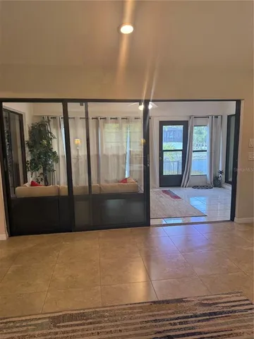 a bedroom with a bed and a night stand