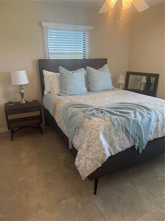3601 Magnolia Way Punta Gorda, FL 33950 - Photo 19 of 26 a bedroom with a bed and a night stand