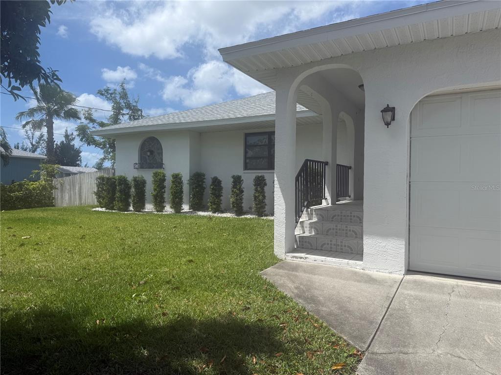 3601 Magnolia Way Punta Gorda, FL 33950 - Photo 23 of 26 a view of a porch with a yard
