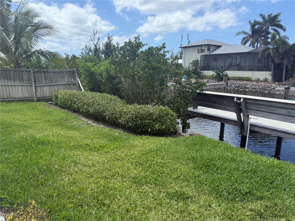 3601 Magnolia Way Punta Gorda, FL 33950 - Photo 6 of 26 a view of a backyard with plants and a patio