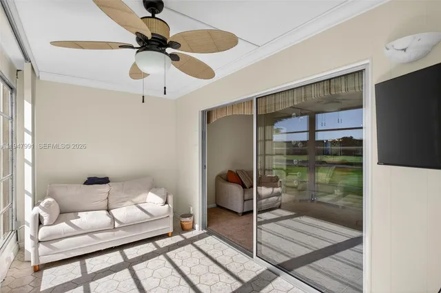 a room with a glass door shower and a couch