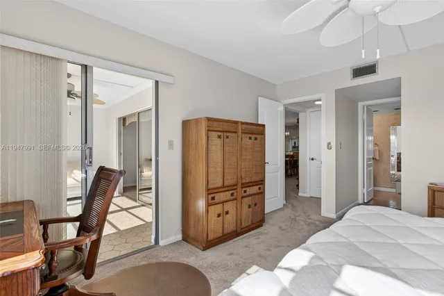 a view of a livingroom with furniture and a window