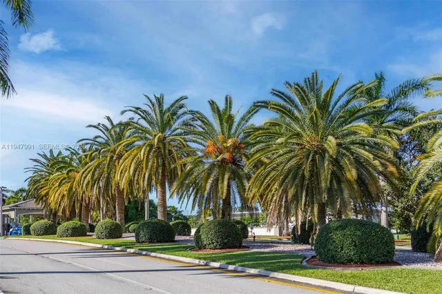 a view of a house with swimming pool and porch with furniture
