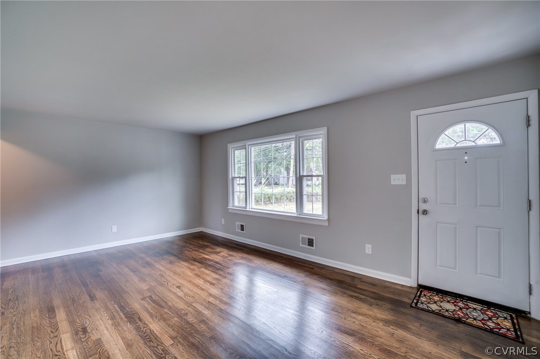 5525 Jahnke Road Richmond, VA 23225 - Photo 12 of 35 an empty room with wooden floor and windows