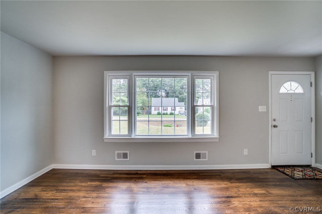 5525 Jahnke Road Richmond, VA 23225 - Photo 13 of 35 a view of an empty room with wooden floor and a window