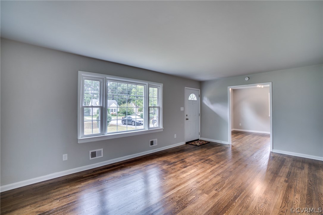 5525 Jahnke Road Richmond, VA 23225 - Photo 15 of 35 an empty room with wooden floor and windows