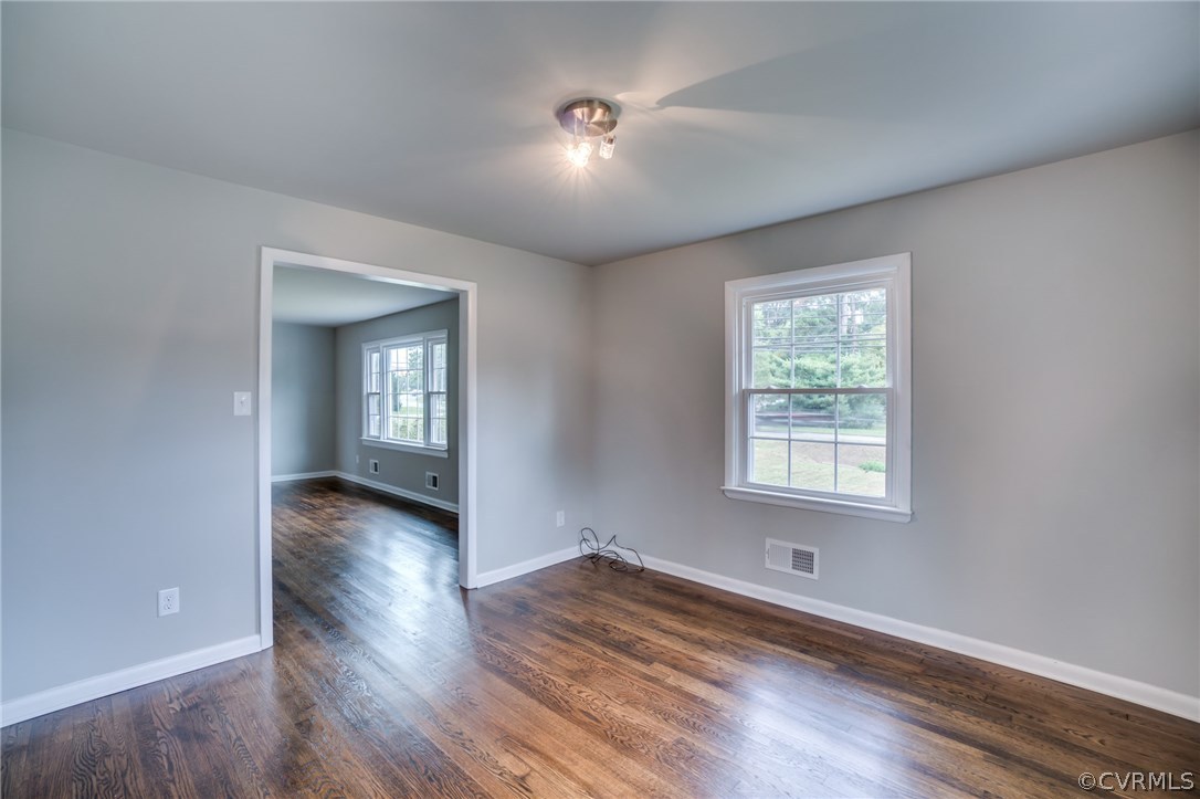 5525 Jahnke Road Richmond, VA 23225 - Photo 17 of 35 an empty room with wooden floor and windows