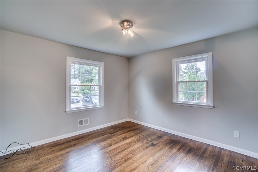 5525 Jahnke Road Richmond, VA 23225 - Photo 18 of 35 a view of an empty room with wooden floor and a window