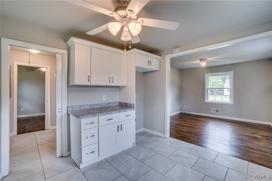 5525 Jahnke Road Richmond, VA 23225 - Photo 22 of 35 a view of kitchen with granite countertop cabinets and window